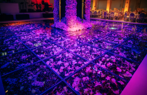 flower filled dance floor, purple light - wedding design - event design